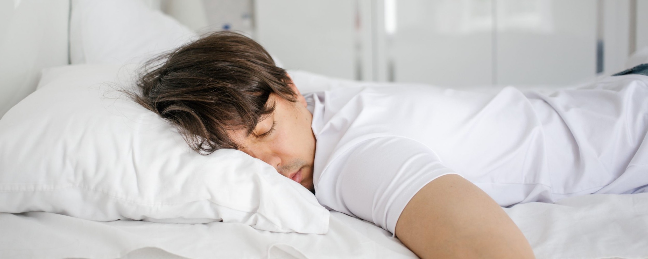 Young-man-sleeping-soundly-in-bed-scaled Young-man-sleeping-soundly-in-bed-scaled